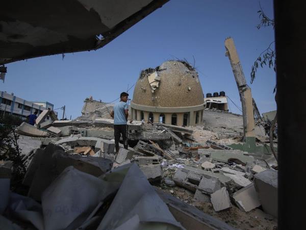 A boy at the site of a destroyed mosque following an Israeli airstrike in Khan Younis, Gaza Strip, on Sunday.