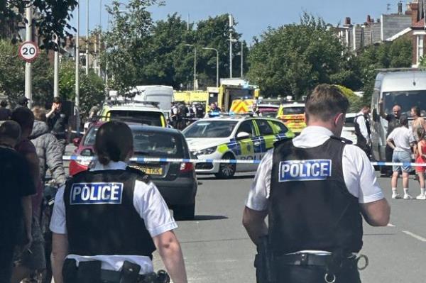 Two police officers at the scene